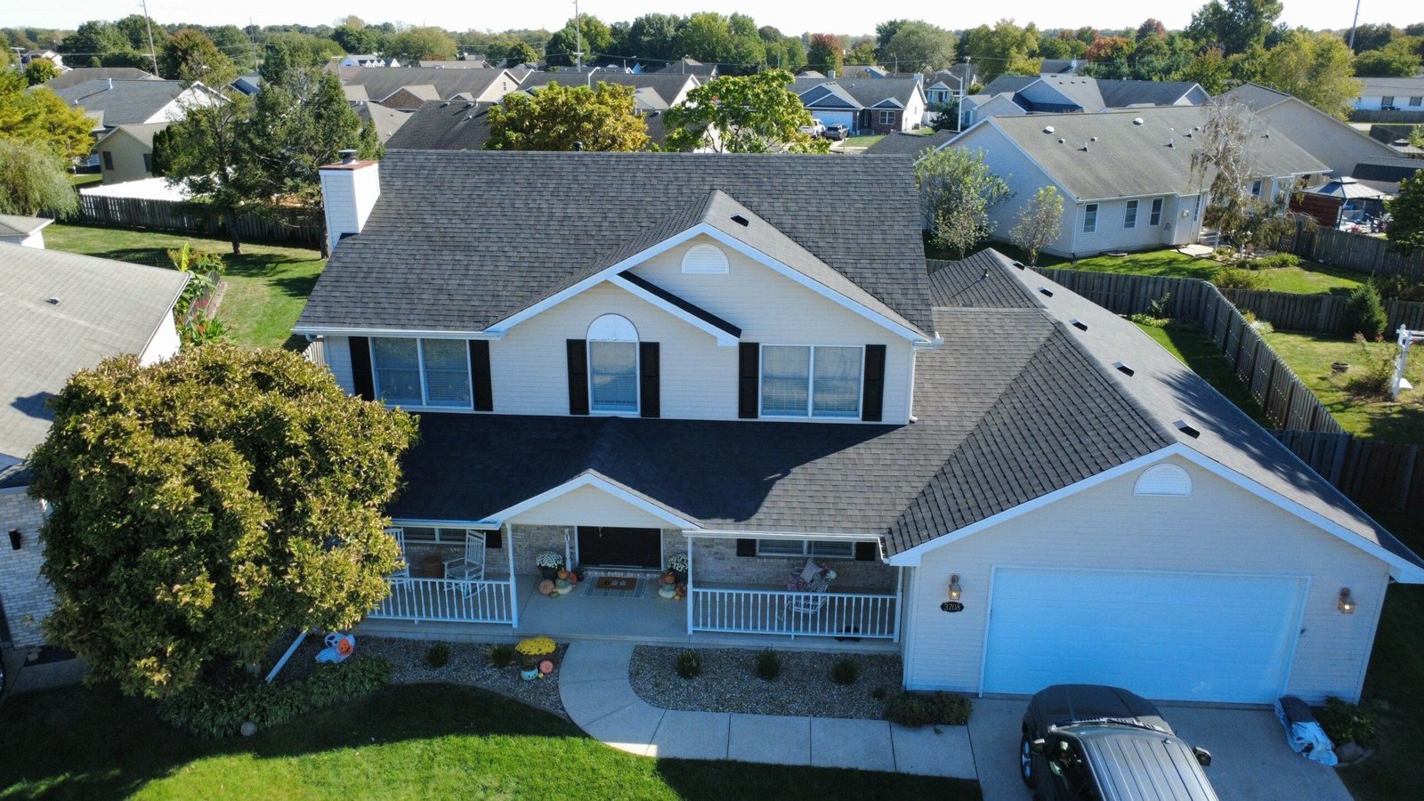 Front of a Springfield, IL home with a new black IKO Blackstone shingle roof installed by Westside Construction